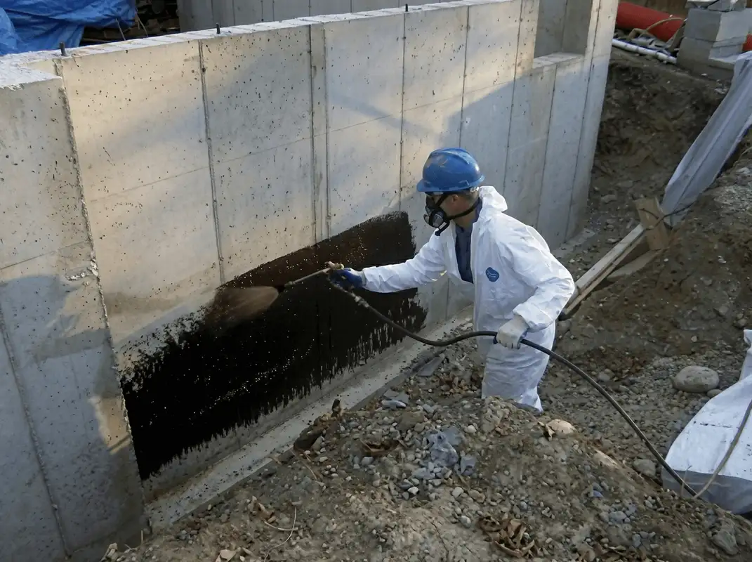 Professional waterproofing the exterior walls of the basement in Charleston, SC