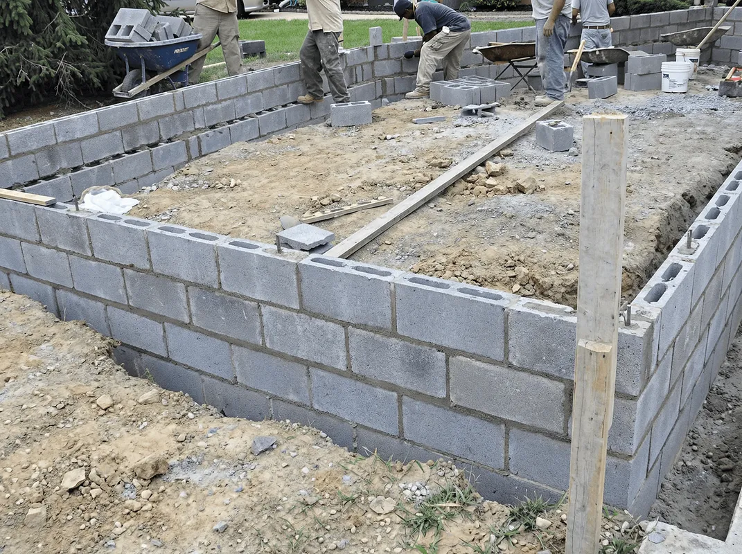 Professionals building a foundation with blocks in Charleston, SC