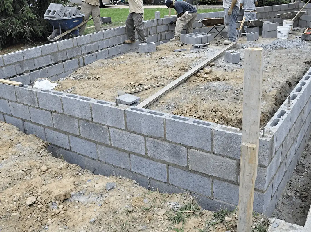 Professionals building a foundation with blocks in Charleston, SC