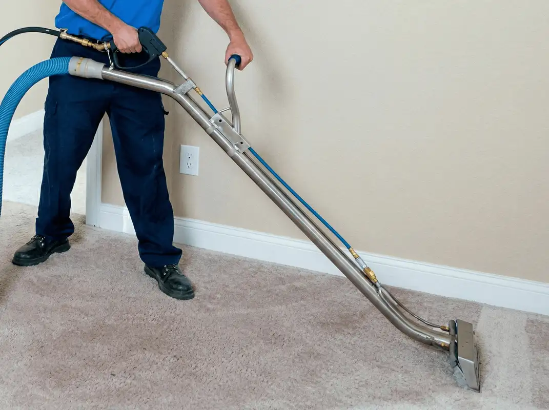 Professional operating a liquid removal machine on a carpeted floor in Charleston, SC